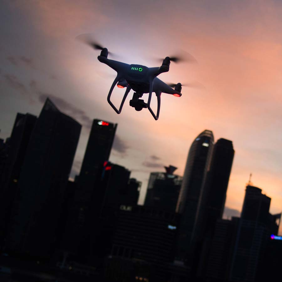Picture of a drone flying over a city